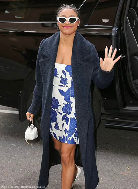 American actress, singer and dancer Ariana DeBose is wearing the SENTALER Bouclé Alpaca Long Notched Collar Wrap Coat in New York.