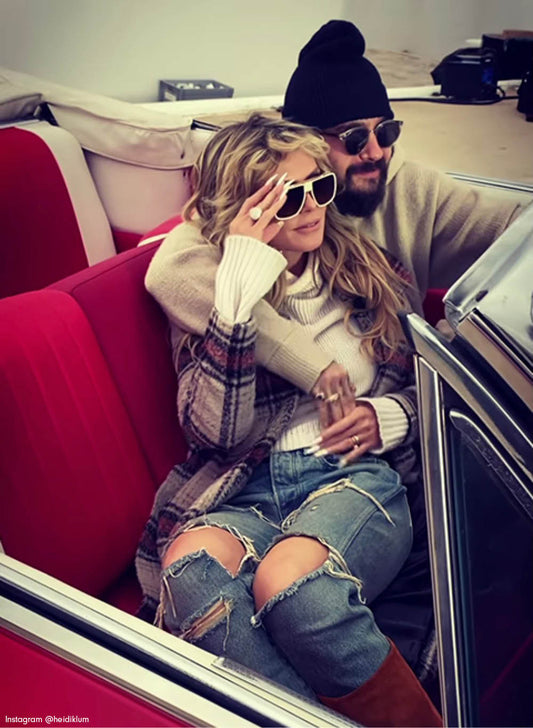 German-American model, television host and entrepreneur Heidi Klum is wearing the SENTALER Plaid Long Notched Collar Wrap Coat in Sand Plaid in a car in Greece.