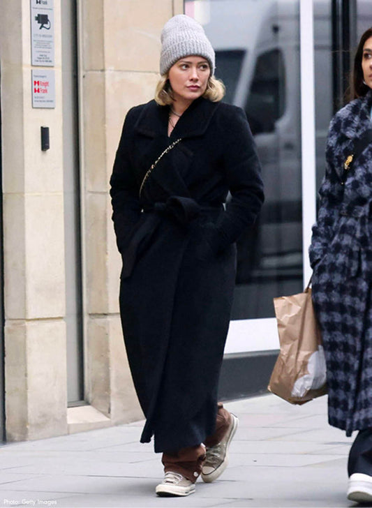 American actress Hillary Duff is wearing the SENTALER Bouclé Alpaca Long Notched Collar Wrap Coat in Black walking in the streets of London.