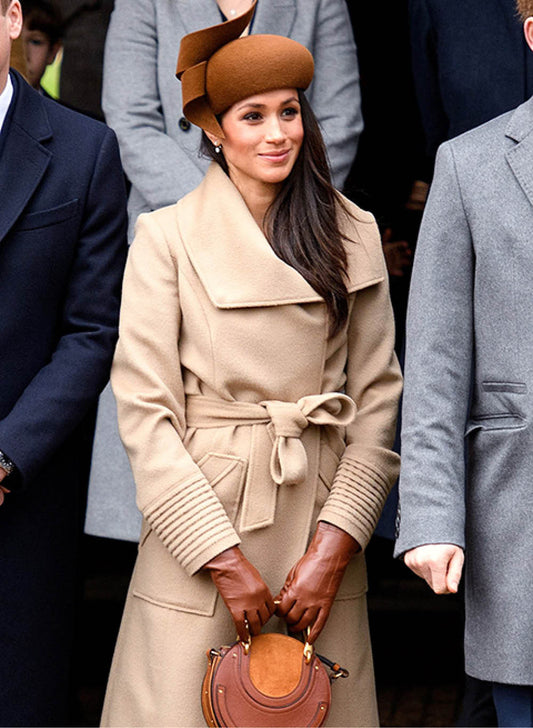 The Duchess of Sussex Meghan Markle is wearing the SENTALER Long Wide Collar Wrap Coat in Camel on Christmas Day with the royal family.