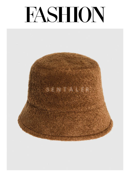Image features the FASHION logo and an off-figure image of the Sentaler Mens Bouclé Alpaca Bucket Hat featured in Bouclé Alpaca and available in Caramel Café.