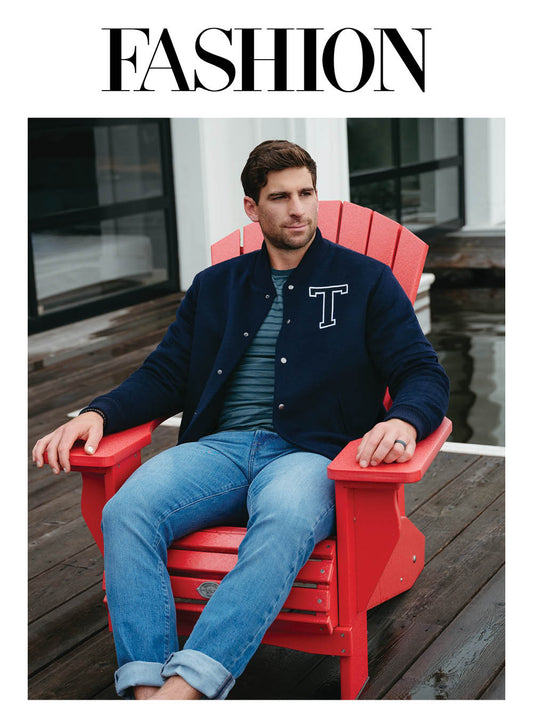 Image features the Fashion logo and an image of Toronto Maple Leafs Captain, John Tavares wearing the SENTALER x John Tavares Varsity Jacket in Technical Baby Alpaca in Deep Navy. 