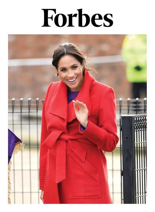 Image features the Forbes logo and an image of the Duchess of Cambridge, Meghan Markle wearing the Sentaler Long Wide Collar Wrap Coat featured in Baby Alpaca and available in Scarlet Red.