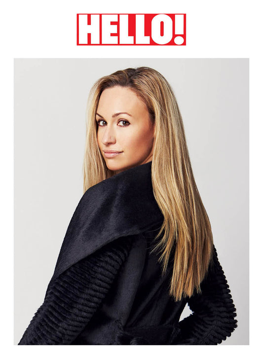 Image features the HELLO! logo and an image of designer, founder, president and creative director of SENTALER, Bojana Sentaler wearing the Sentaler Suri Alpaca Long Shawl Collar Wrap Coat with Ribbed Sleeves featured in Suri Alpaca and available in Black.