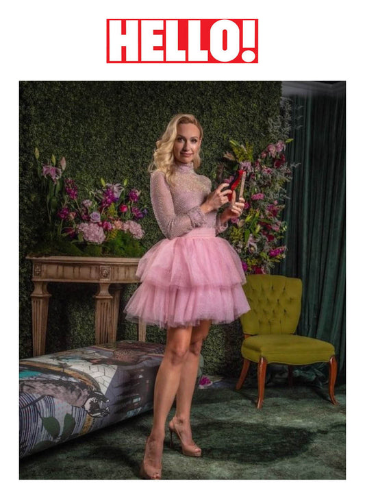 Image features the HELLO! logo and an image of designer, founder, president and creative director of SENTALER, Bojana Sentaler holding her award for Outerwear Brand of the Year.