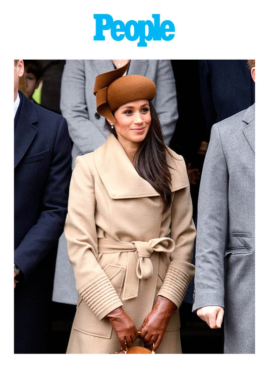 Image features the People logo and an image of the Duchess of Cambridge, Meghan Markle wearing the Sentaler Long Wide Collar Wrap Coat featured in Baby Alpaca and available in Camel.