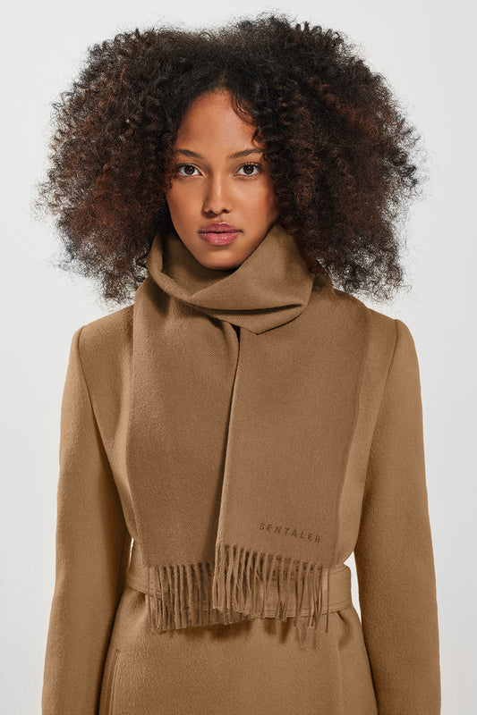 Sentaler Baby Alpaca Classic Scarf and the Long Notched Collar Wrap Coatcrafted in Baby Alpaca and in Dark Camel. Seen from front close up on female model.