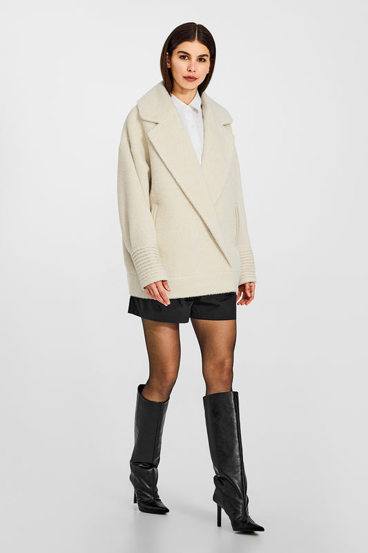 Sentaler Bouclé Alpaca Aviator Ivory Jacket in Bouclé Alpaca wool. Seen from side on female model.