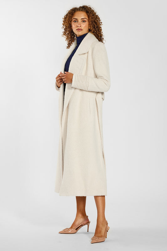 Sentaler Bouclé Alpaca Long Notched Collar Wrap Coat crafted in Bouclé Alpaca wool and in Ivory. Seen from side open on female model.