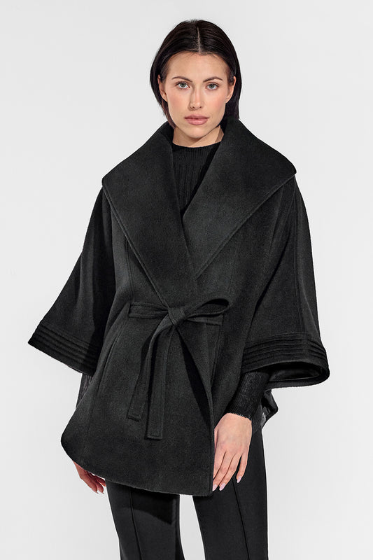 Sentaler Cape with Shawl Collar and Belt featured in Baby Alpaca and available in Black. Seen from front above the knees on female model who is wearing the cape belted.