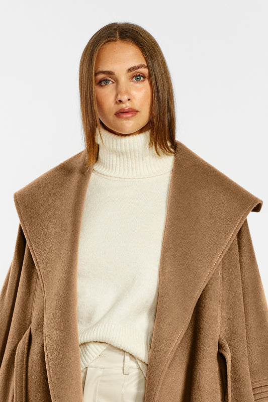 Sentaler Cape with Shawl Collar and Belt crafted in Baby Alpaca wool and in Dark Camel. Seen from front open close up on female model.