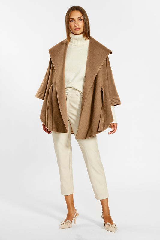 Sentaler Cape with Shawl Collar and Belt crafted in Baby Alpaca wool and in Dark Camel. Seen from front open on female model.