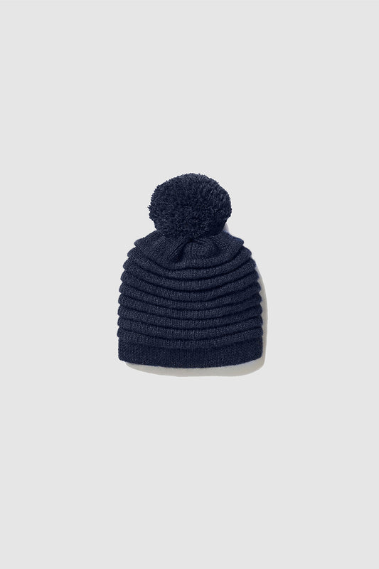 Sentaler Kids (1-5 Years) Ribbed Hat with Oversized Knit Pompon featured in Baby Alpaca and available in Navy Blue. Seen as off figure.