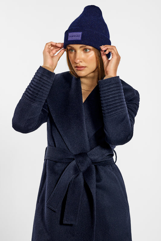 Sentaler Alpaca Beanie and Mid Length Shawl Collar Wrap Coat crafted in Baby Alpaca wool and in Navy. Seen from side above the knees on female model.