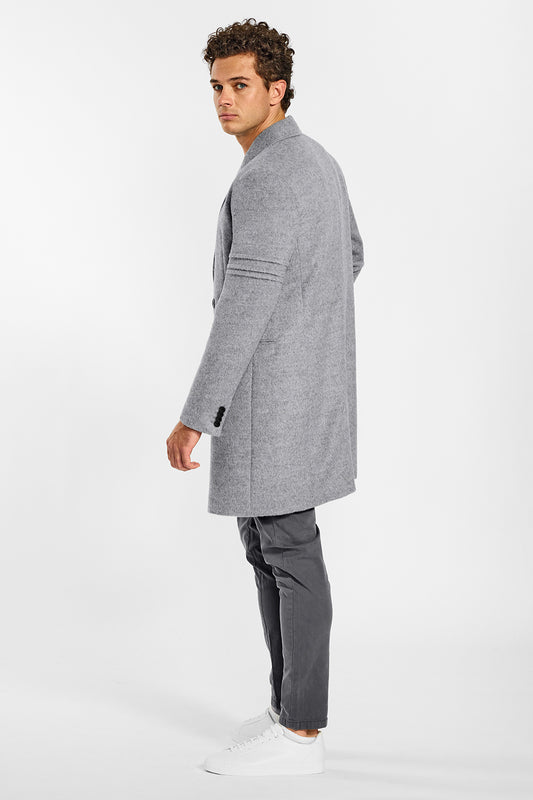Sentaler Baby Alpaca Double Breasted Shale Grey Overcoat in Technical Baby Alpaca wool. Seen from side on male model.