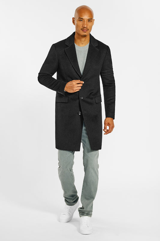 Sentaler Technical Baby Alpaca Notched Lapel Overcoat crafted in Technical Baby Alpaca and available in Black. Seen from front on male model.