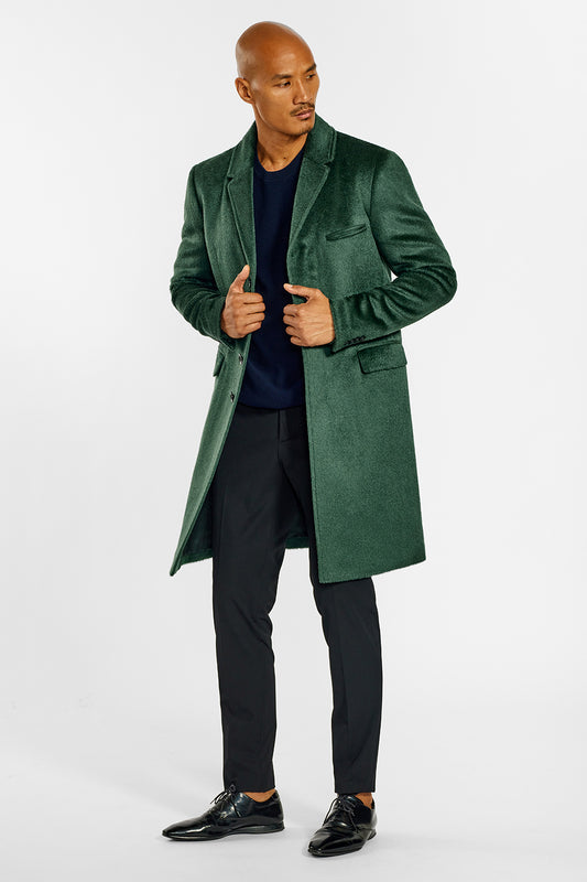 Sentaler Technical Suri Alpaca Notched Lapel Overcoat crafted in Technical Suri Alpaca and available in Deep Emerald. Seen from side open on male model.