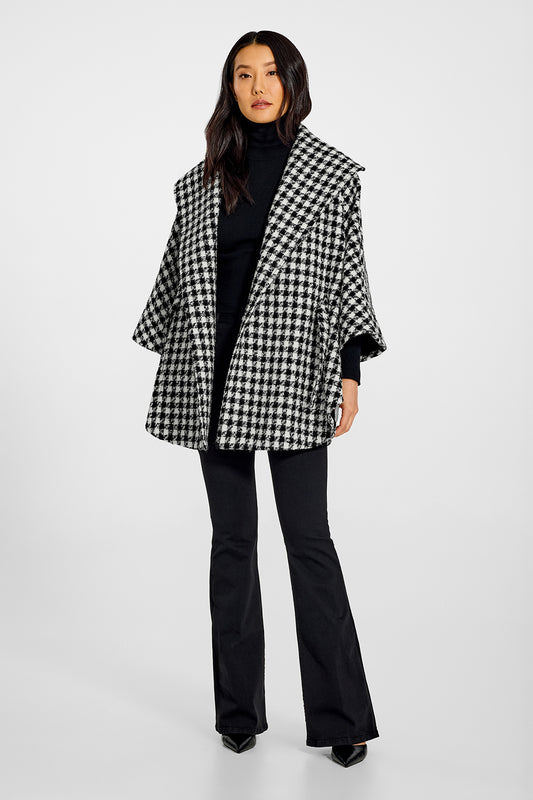 Sentaler Tweed Black and White Houndstooth Cape in Tweed Suri Alpaca wool. Seen from front open on female model.