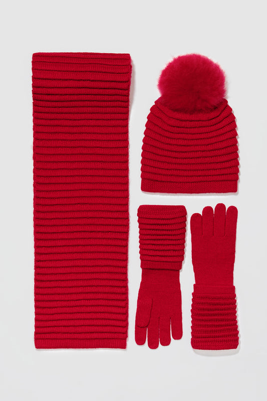 Sentaler Adult Ribbed Hat With Oversized Fur Pompon featured in Baby Alpaca and available in Red. Seen with scarf and gloves off model.