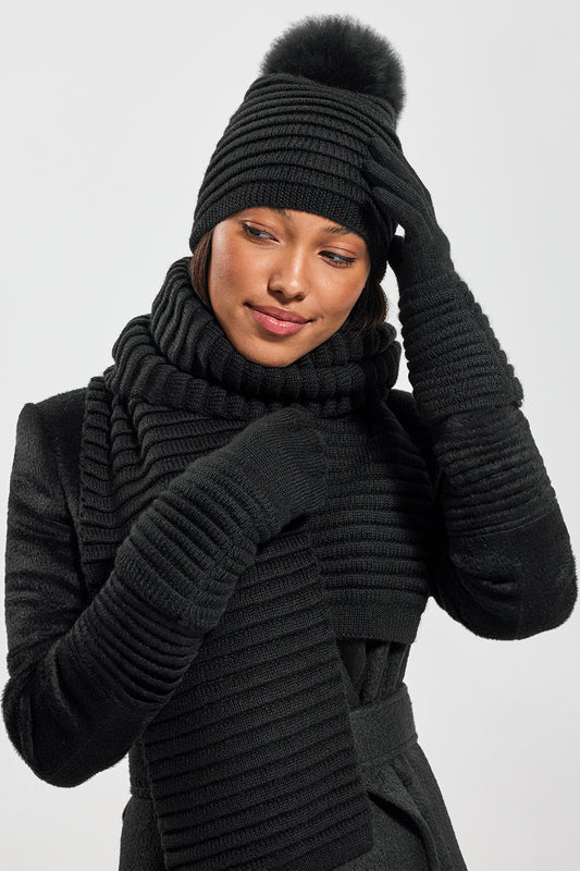 Sentaler Adult Ribbed Scarf, Adult Ribbed Scarf and Adult Ribbed Gloves featured in Baby Alpaca and available in Black. Seen from front on model.