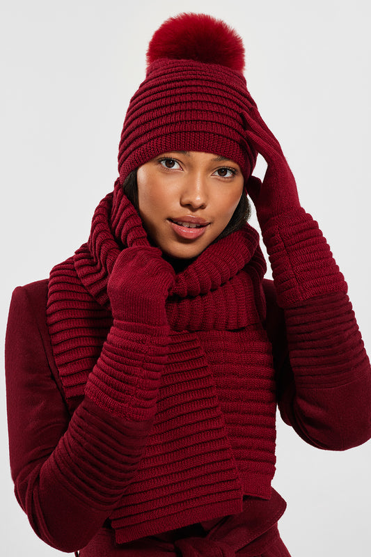 Sentaler Adult Ribbed Hat With Oversized Fur Pompon featured in Baby Alpaca and available in Garnet Red. Seen with scarf and glove from front.
