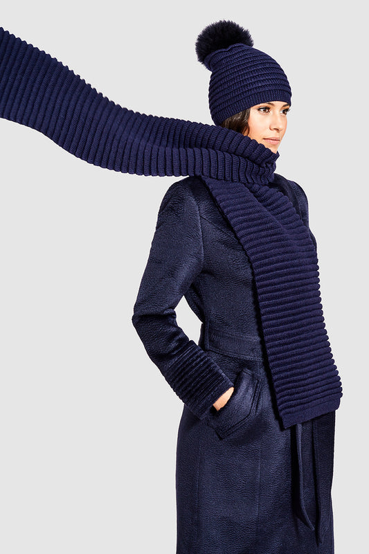 Sentaler Adult Ribbed Hat With Oversized Fur Pompon featured in Baby Alpaca and available in Navy. Seen in action.