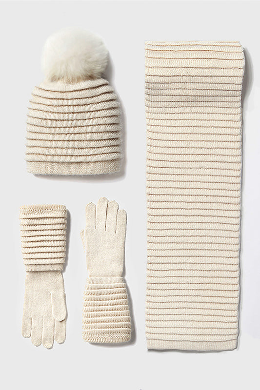 Sentaler Adult Ribbed Hat With Oversized Fur Pompon, Ribbed Scarf and Ribbed Gloves featured in Baby Alpaca and available in Ivory. Seen as off figures.