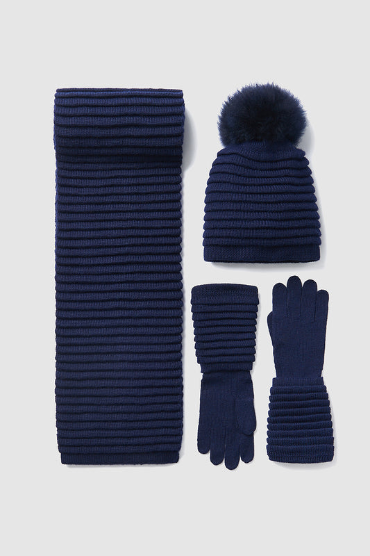 Sentaler Adult Ribbed Scarf featured in Baby Alpaca and available in Navy. Seen with hat and gloves off model.