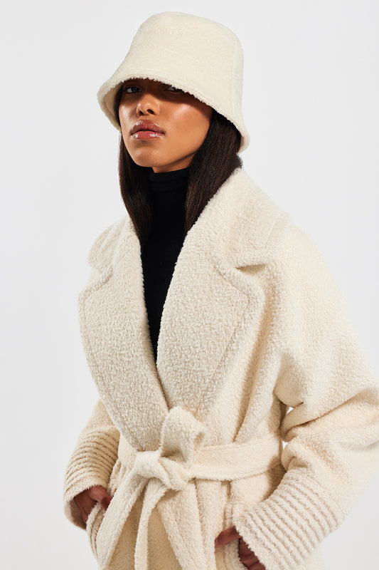 Sentaler Bouclé Alpaca Bucket Hat featured in Bouclé Alpaca and available in Ivory. Seen from side close up.