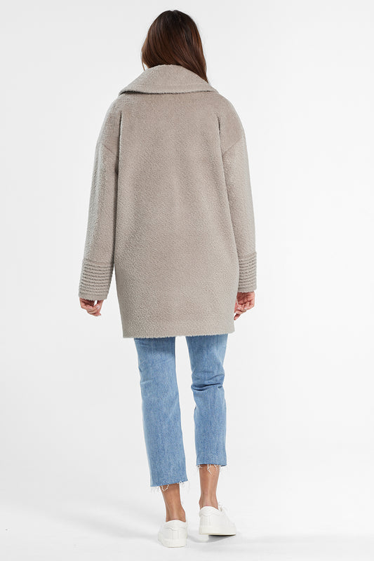 Sentaler Bouclé Alpaca Mid Length Oversized Notched Collar Coat featured in Bouclé Alpaca and available in Sand. Seen from back.