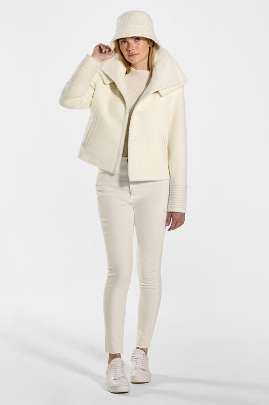 Sentaler Bouclé Alpaca Moto Jacket with Signature Double Collar and Bouclé Alpaca Bucket Hat featured in Bouclé Alpaca and available in Ivory. Seen from front open on model.