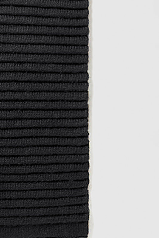 Sentaler Kids (6-14 Years) Ribbed Scarf featured in Baby Alpaca and available in Black. Seen as off figure close up.