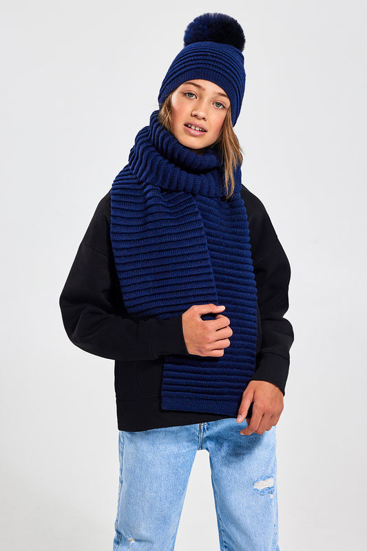 Sentaler Kids (6-14 Years) Ribbed Scarf featured in Baby Alpaca and available in Navy. Seen from front above the knee.