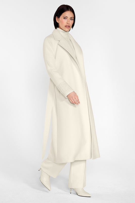 Sentaler Long Notched Collar Raglan Sleeve Wrap Coat featured in Baby Alpaca and available in Ivory. Seen from side on female model who is wearing the coat open.