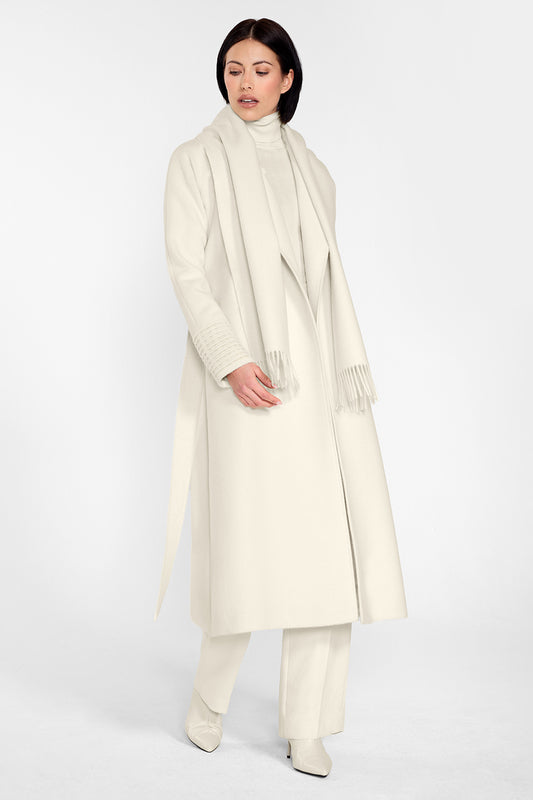 Sentaler Long Notched Collar Raglan Sleeve Wrap Coat and Baby Alpaca Classic Scarf featured in Baby Alpaca and available in Ivory. Seen from side on female model who is wearing the coat open and the scarf draped around her neck.