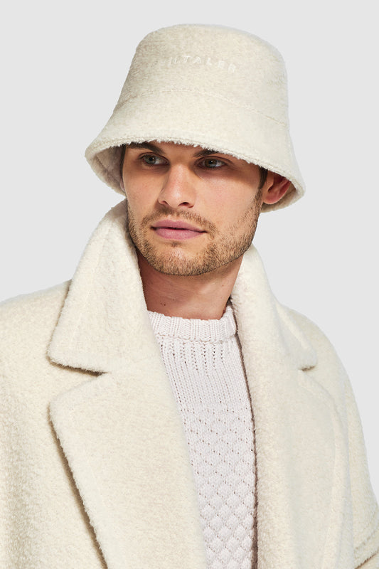 Sentaler Mens Bouclé Alpaca Bucket Hat featured in Bouclé Alpaca and available in Ivory. Seen from front close up on model.